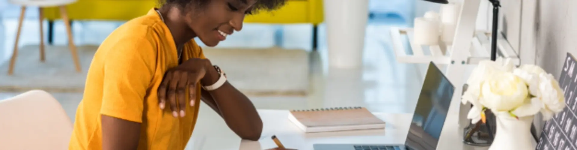 woman working at a desk with a laptop